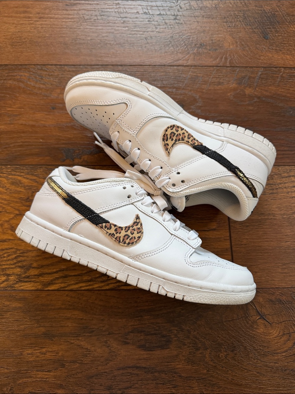 Nike Dunk low SE White Sneakers w/ Leopard Swoosh Black Trim women’s size 6.5